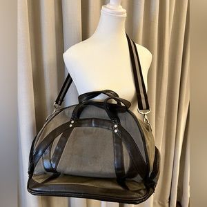 Lululemon gym bag in neutral grey colour with brown leather accented trim.